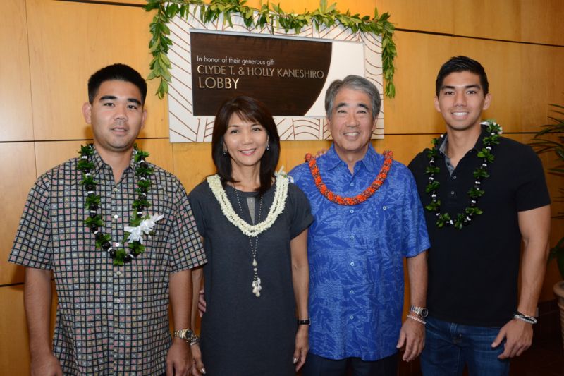 The Kaneshiro family standing with the newly renamed main entrance of Pali Momi