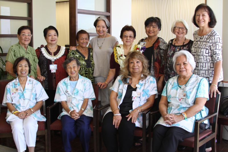 Joanne Abe with current and retired volunteers, including some who worked with her parents.