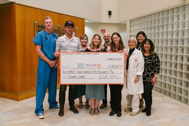 Peter Stengaard and Jennifer Gross with Wilcox Medical Center staff at the check presentation