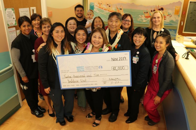 The Miura Family (wearing lei) with Kapiolani staff who work with Tracie and/or cared for Tammie Miura