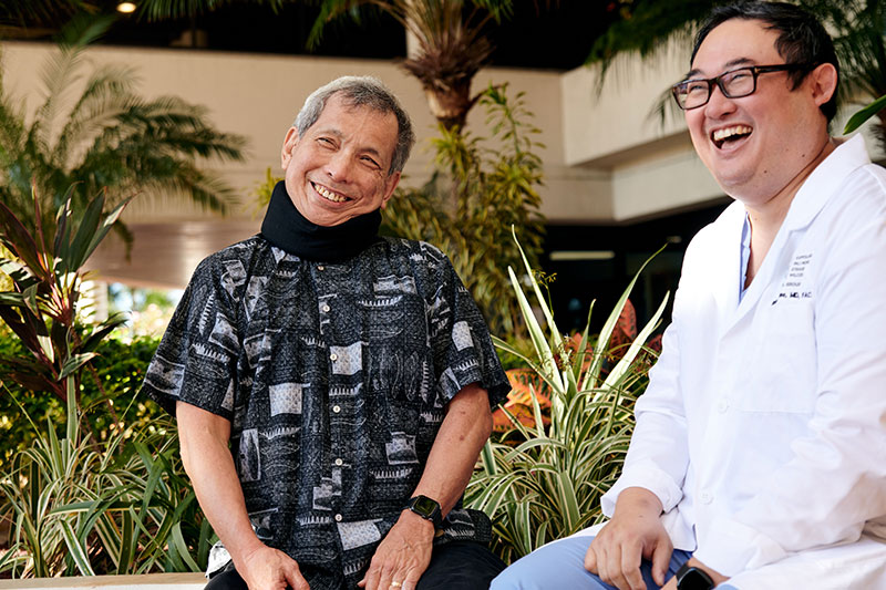 Glenn Tango with Dr. Richard Inae, the surgeon who operated on him twice in less than two years.